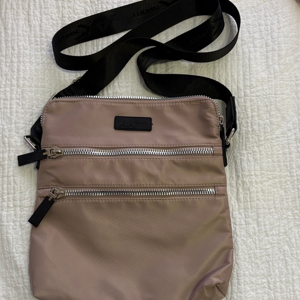 Anne Klein Sport Lilac Nylon Crossbody Bag with Black Adjustable Strap.